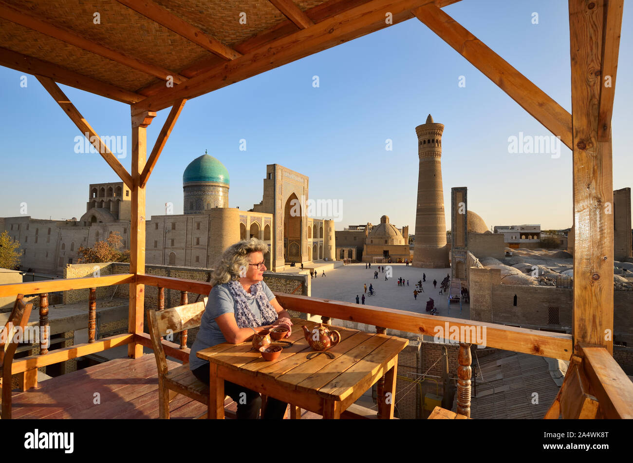 View to the Mir-i-Arab Madrassah and Kalon minaret. Bukhara, a UNESCO World Heritage Site. Uzbekistan (MR) Stock Photo