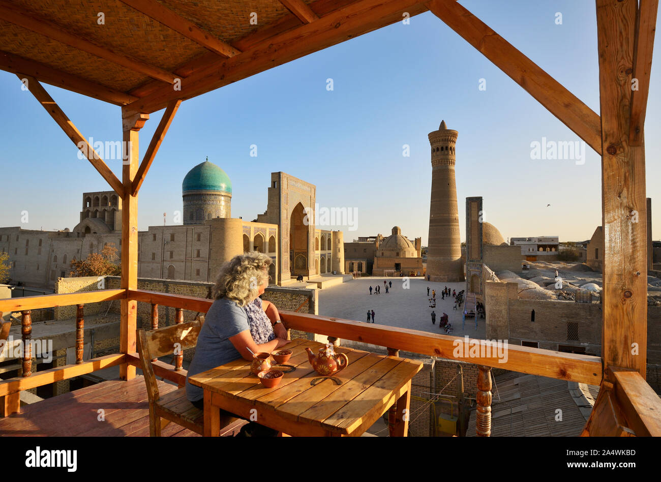 View to the Mir-i-Arab Madrassah and Kalon minaret. Bukhara, a UNESCO World Heritage Site. Uzbekistan (MR) Stock Photo