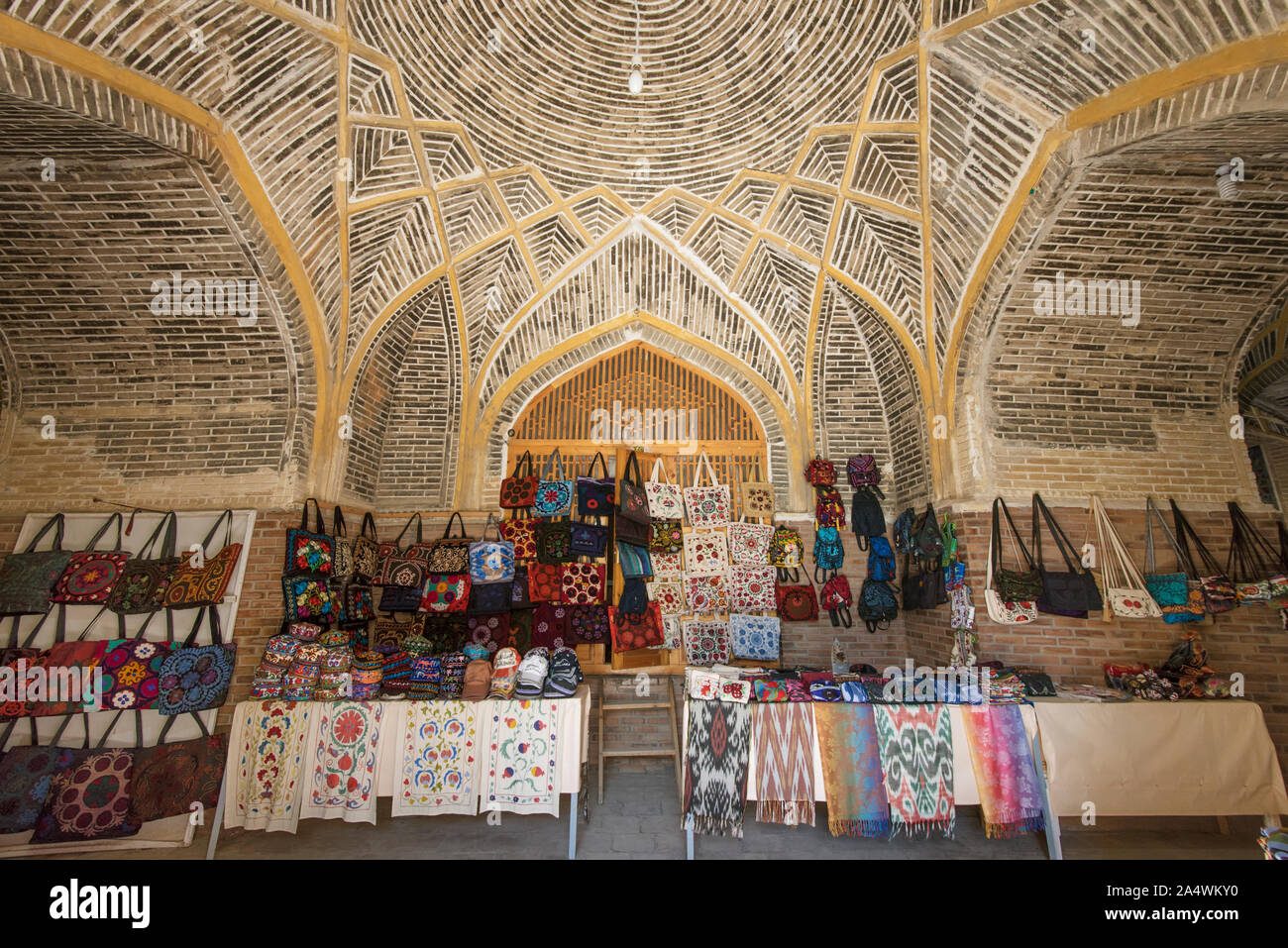 Handicrats for sale. Kukaldosh Madrassah (1568-69). Bukhara, a UNESCO World Heritage Site. Uzbekistan Stock Photo