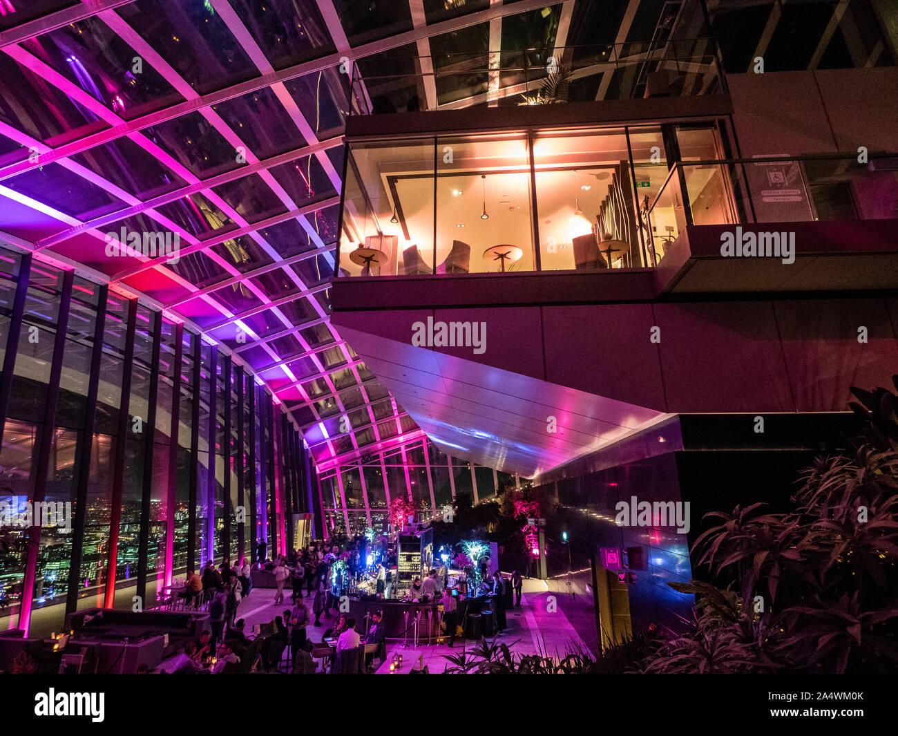 The Sky Garden at night, a 360 degree viewing area with restaurants and gardens inside the Walkie Talkie skyscraper, London, England. Stock Photo