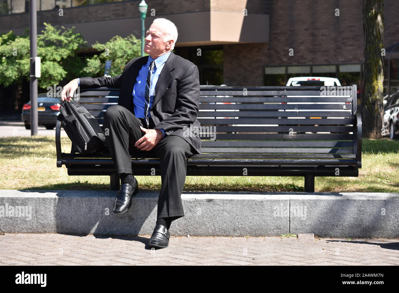 Old men sitting on benches hi-res stock photography and images - Alamy