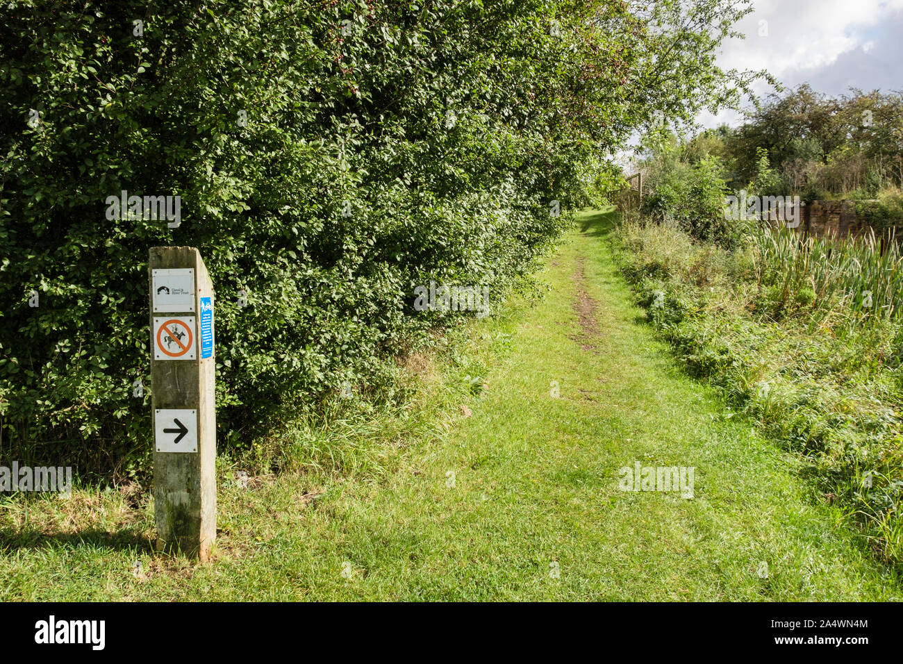Sustrans and permissive path sign on Grantham Canal towpath. Stenwith, Grantham, Lincolnshire, England, UK, Britain Stock Photo