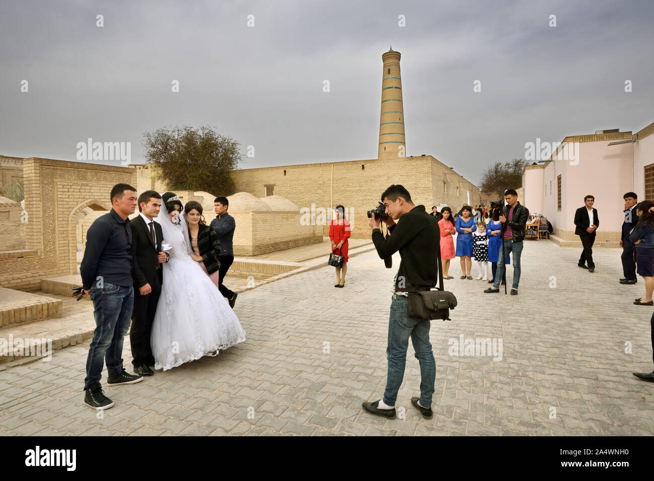 A wedding in the main street of the old town of Khiva, a very popular site for all the festivities in the town. Uzbekistan Stock Photo