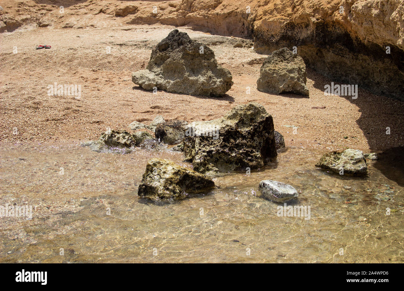 Summer background of hot sand with sea or ocean wave bubbles with copy ...