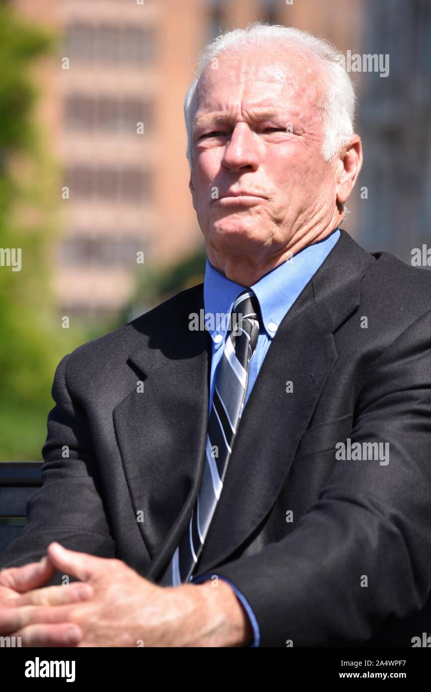 Unemotional Senior Person Wearing Business Suit Sitting Stock Photo - Alamy