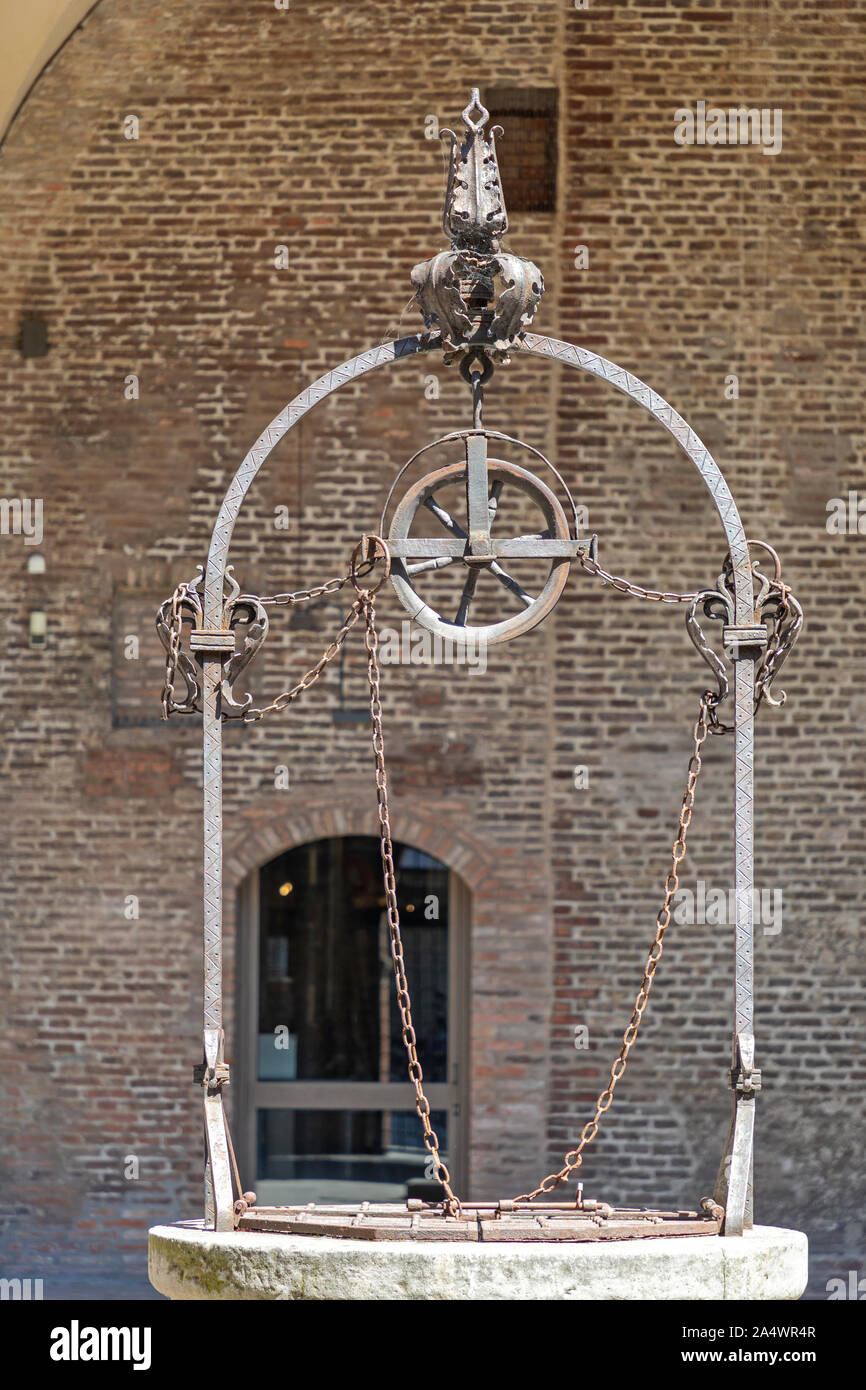 Medieval Well Wheel Pulley in Bologna Italy Stock Photo - Alamy