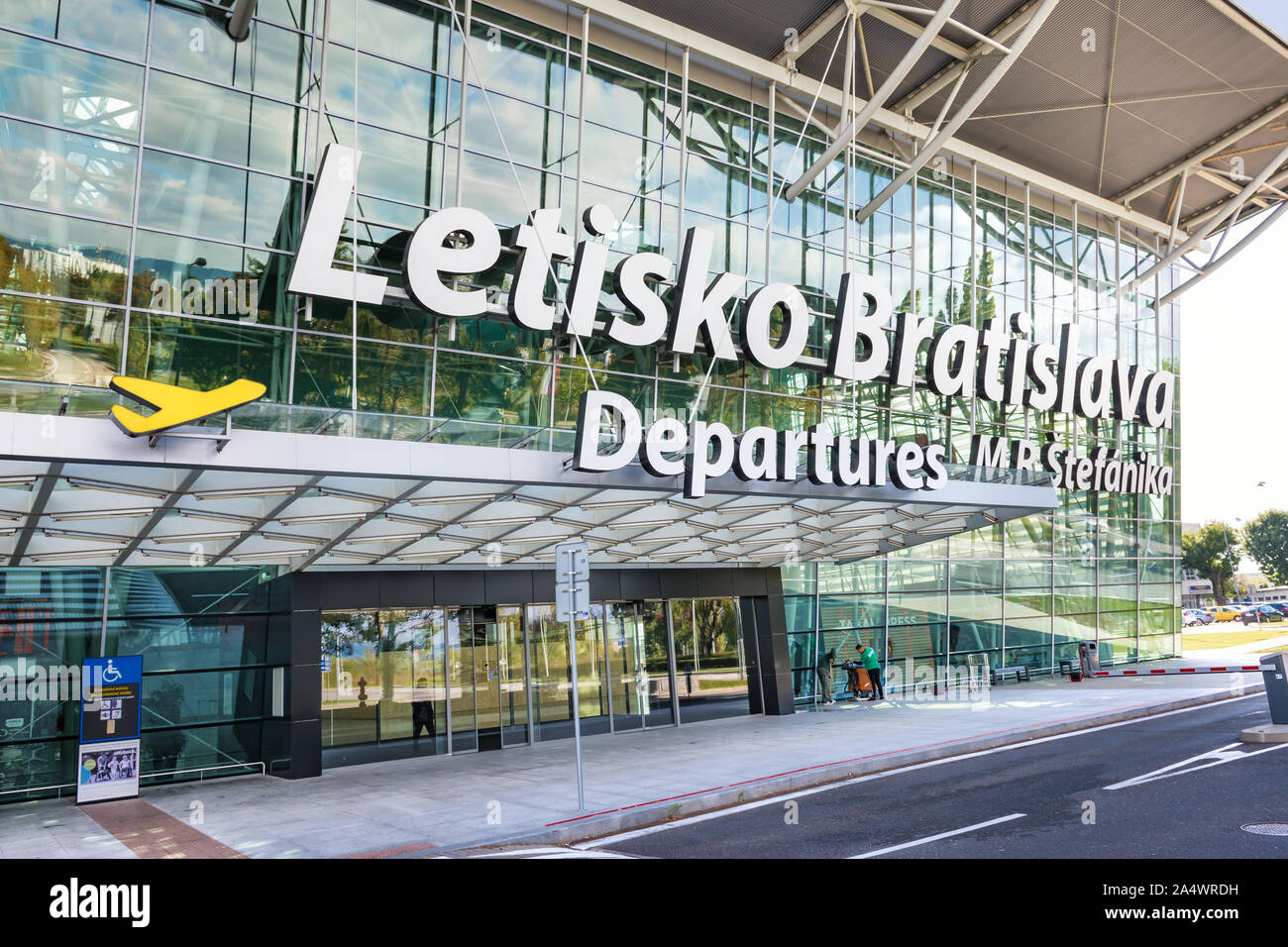 BRATISLAVA, SLOVAKIA – OCTOBER 6 2019: entrance into Departure hall of Bratislava airport terminal with big letter sign “M. R. Stefanik Airport Bratis Stock Photo
