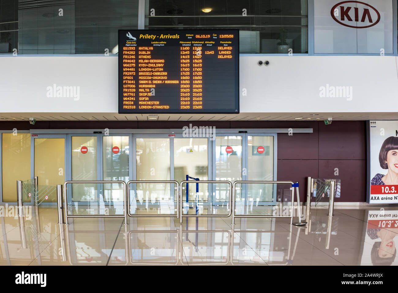 BRATISLAVA, SLOVAKIA – OCTOBER 6 2019: Arrivals board above closed doors of baggage claims room in Arrivals hall of Bratislava airport terminal (Slova Stock Photo