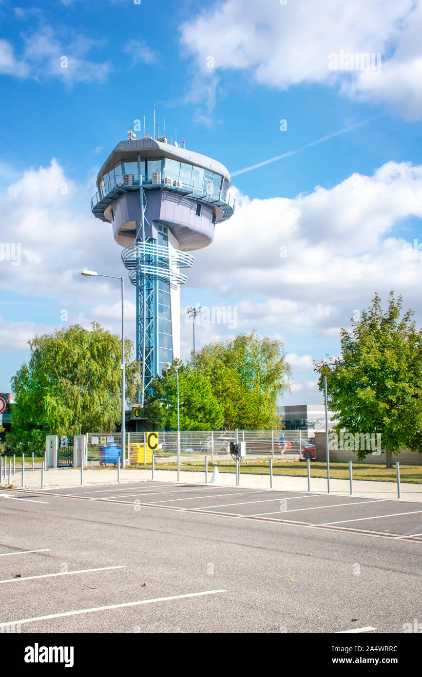 BRATISLAVA, SLOVAKIA – OCTOBER 6 2019: View of empty parking lot in front of air traffic control tower of Bratislava airport (Slovakia) Stock Photo