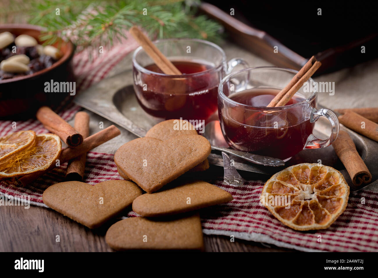 Mulled wine with cinnamon sticks, known as glögg in Sweden. The glasses ...