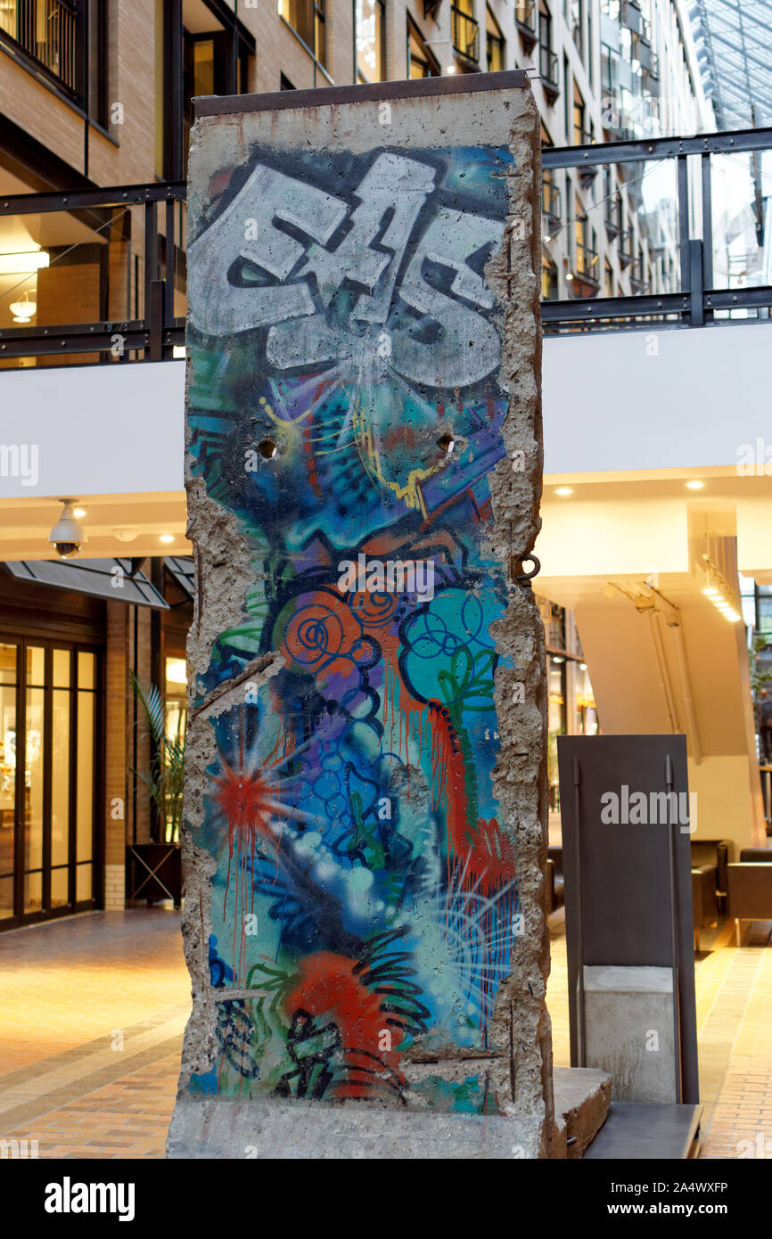 Section of the Berlin Wall on display in the World Trade Centre or Centre de Commerce Mondial, Montreal, Quebec, Canada Stock Photo