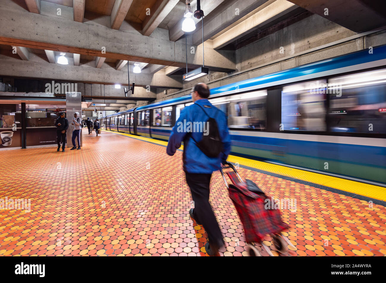 Montreal, CA - 15 October 2019: Subway train leaving Lionel Groux Station. Stock Photo