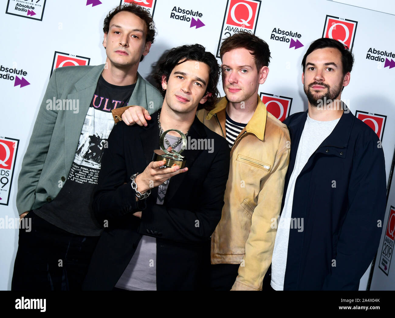 Adam Hann, Matthew Healy, George Daniel and Ross McDonald of the band The 1975 with the Q Best Act in the World award during the Q Awards 2019 in association with Absolute Radio at the Camden Roundhouse, London. Stock Photo