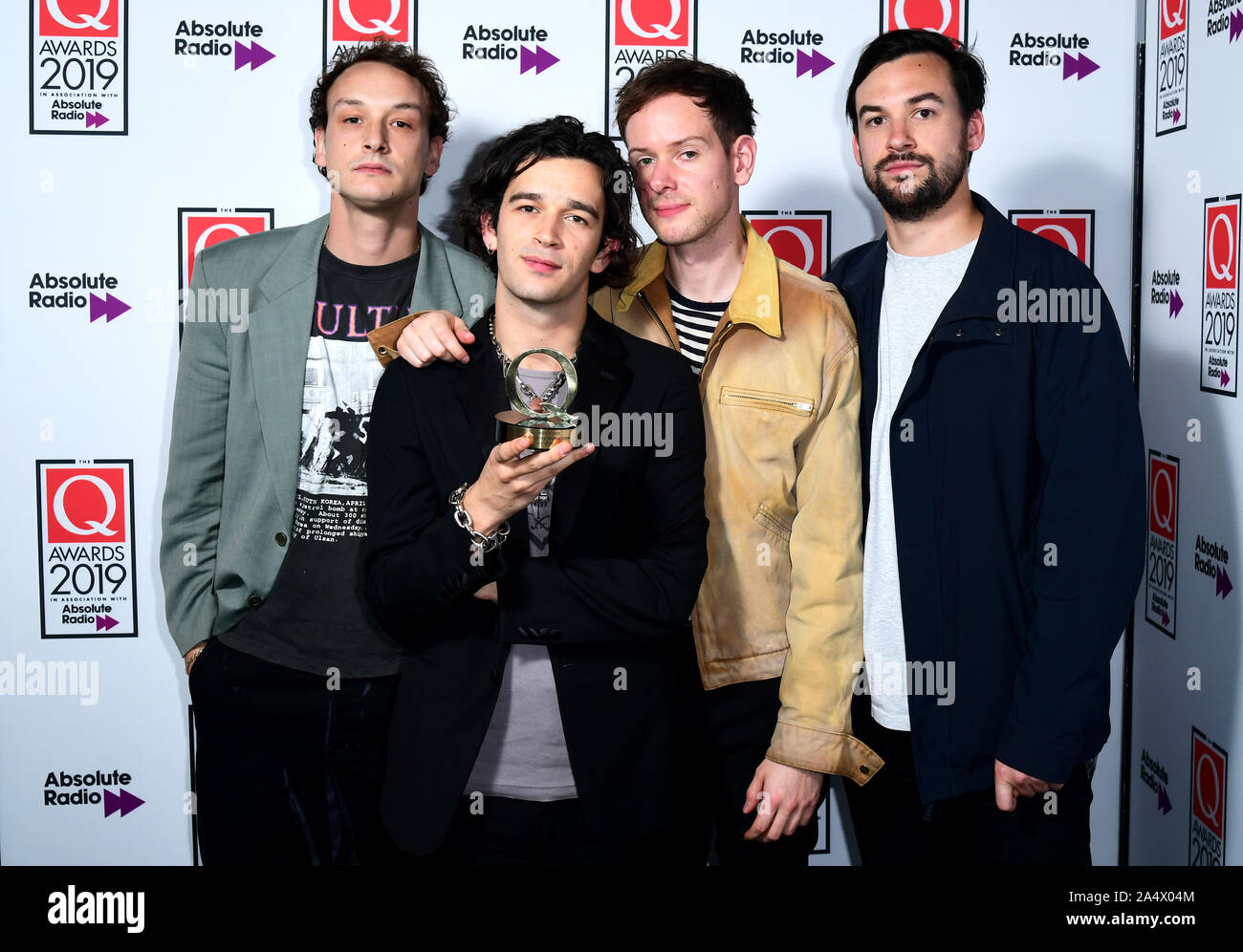 Adam Hann, Matthew Healy, George Daniel and Ross McDonald of the band The 1975 with the Q Best Act in the World award during the Q Awards 2019 in association with Absolute Radio at the Camden Roundhouse, London. Stock Photo