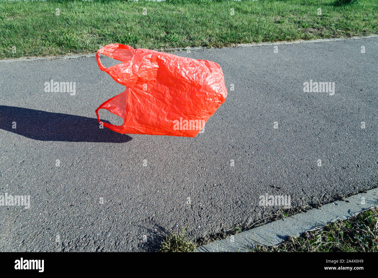 Pollution concept. Plastic bag, flying in the wind in the street Stock