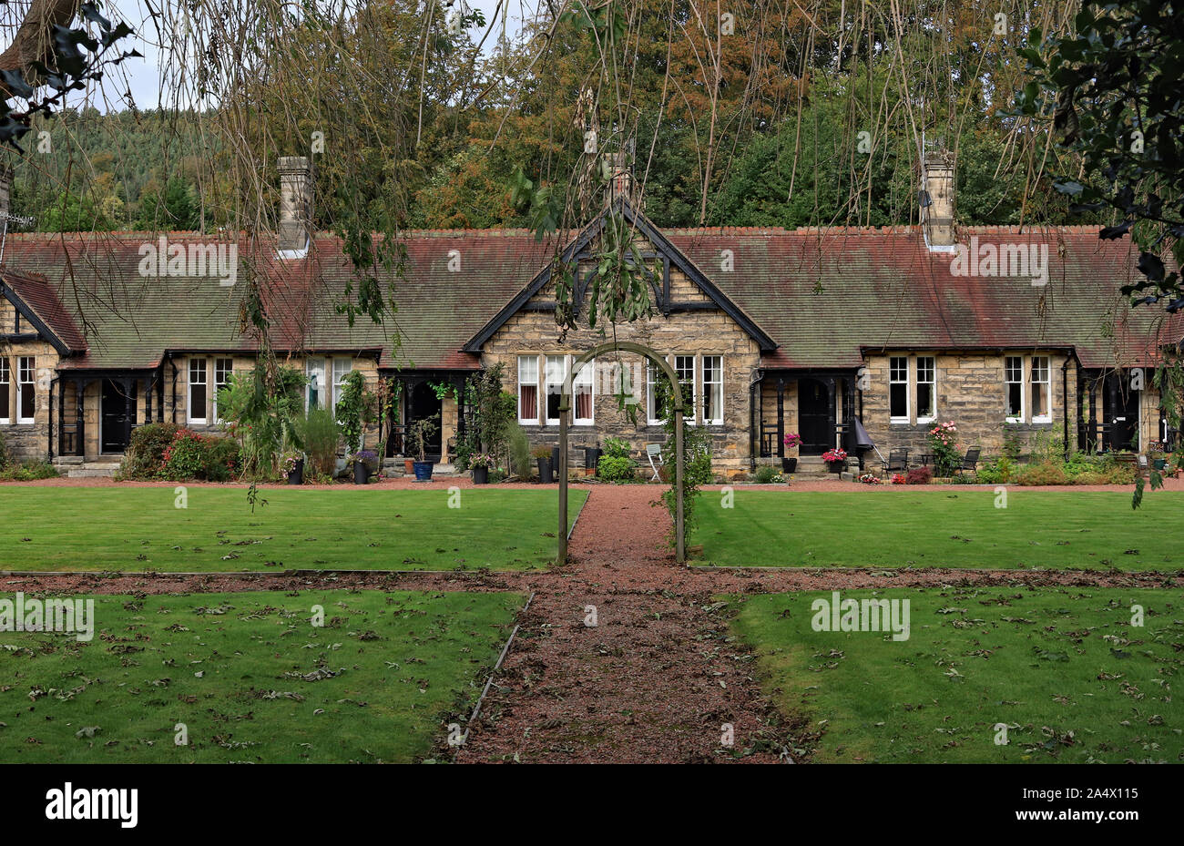 Autumn at the almshouses in Rothbury, in 1896 William Baron