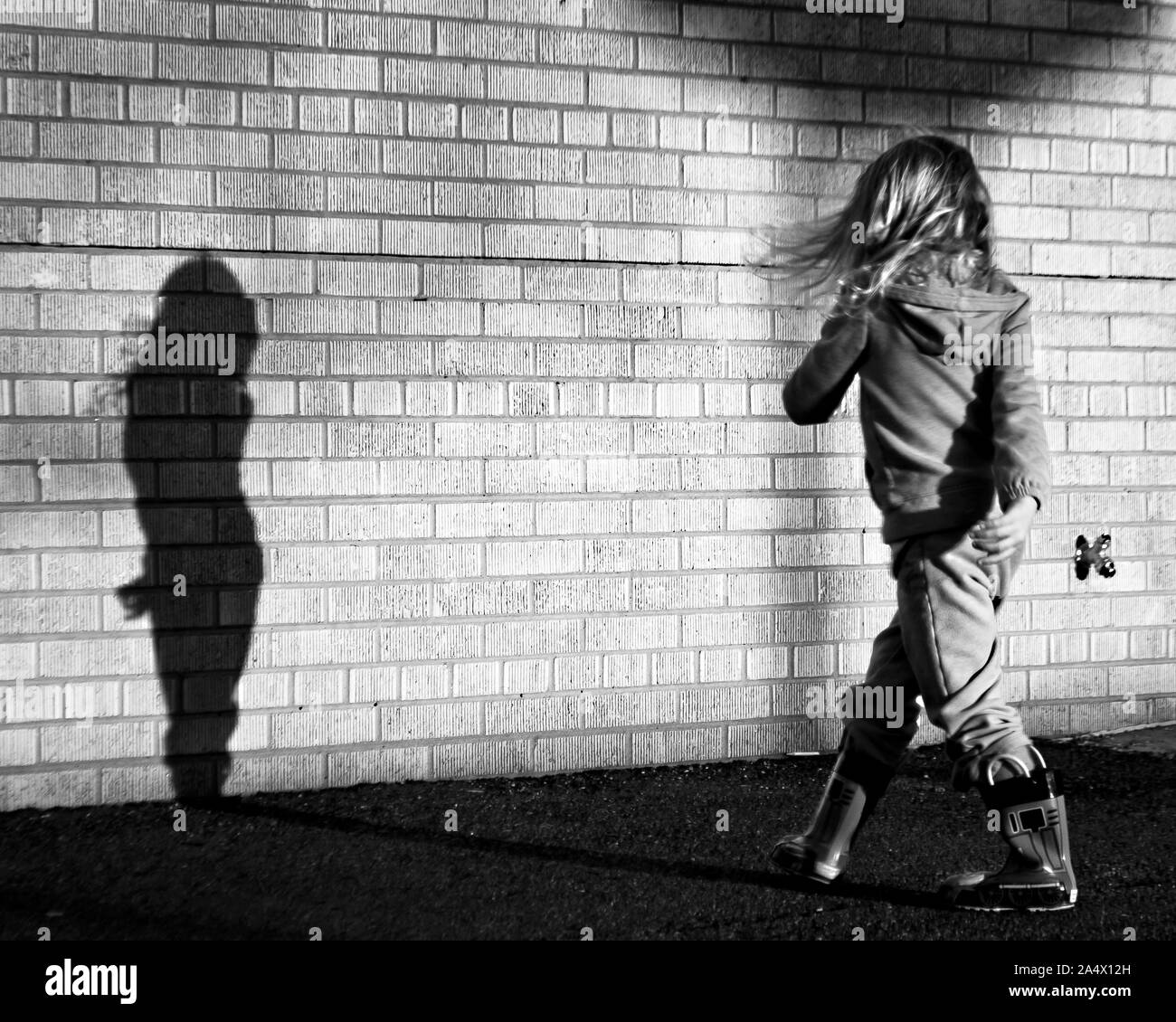 Dancing With Her Shadow Stock Photo