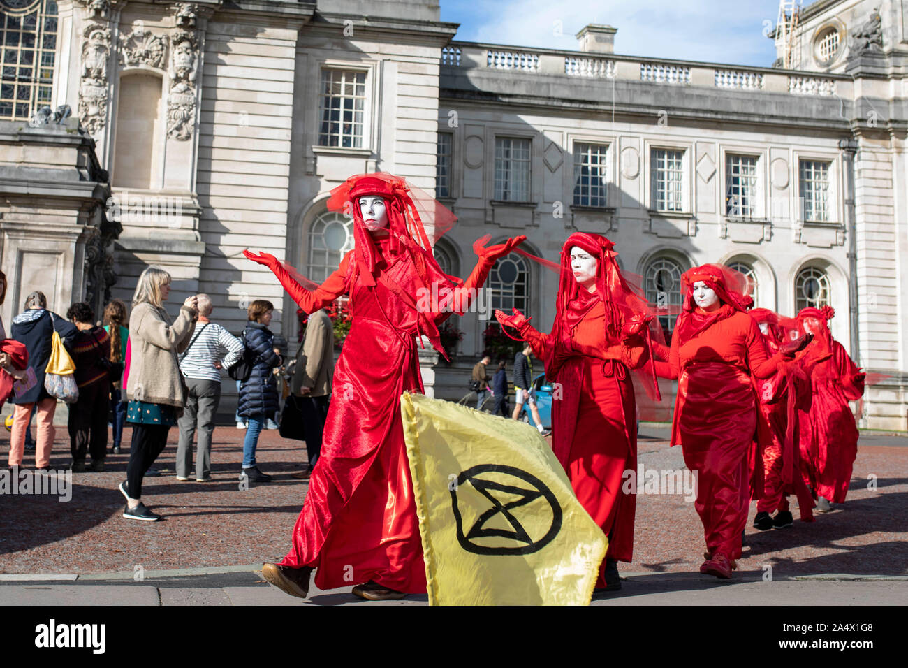 The Red Rebels of global environmental movement Extinction Rebellion outside Cardiff City Hall, October 2019. Stock Photo