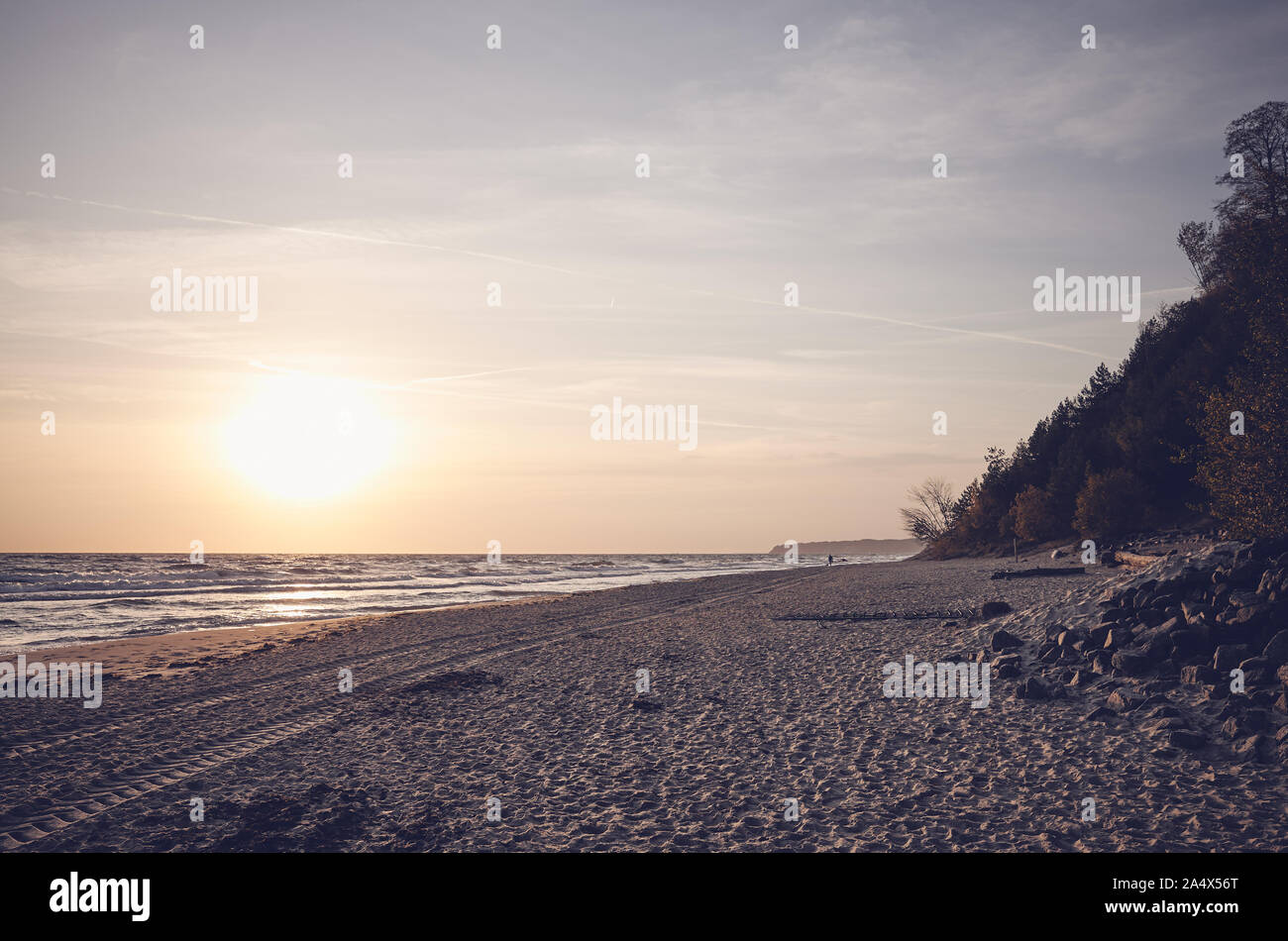 Color toned picture of a beach at sunrise. Stock Photo