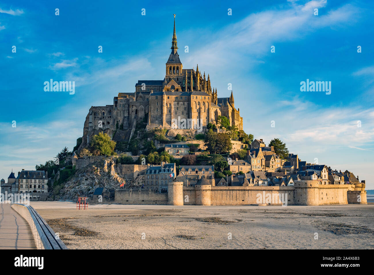 Road leading to Mont Saint Michael with its abbey and low tide Stock Photo