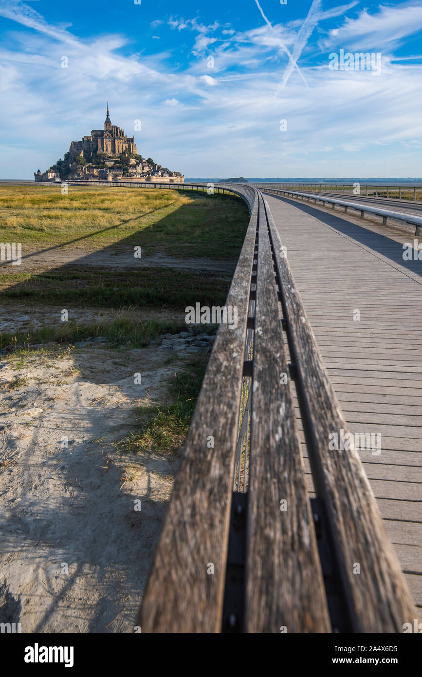 Only access road to Mont Saint Michael. Access is restricted, it can only be accessed by bus, horse carriage and vehicles with special permission for Stock Photo