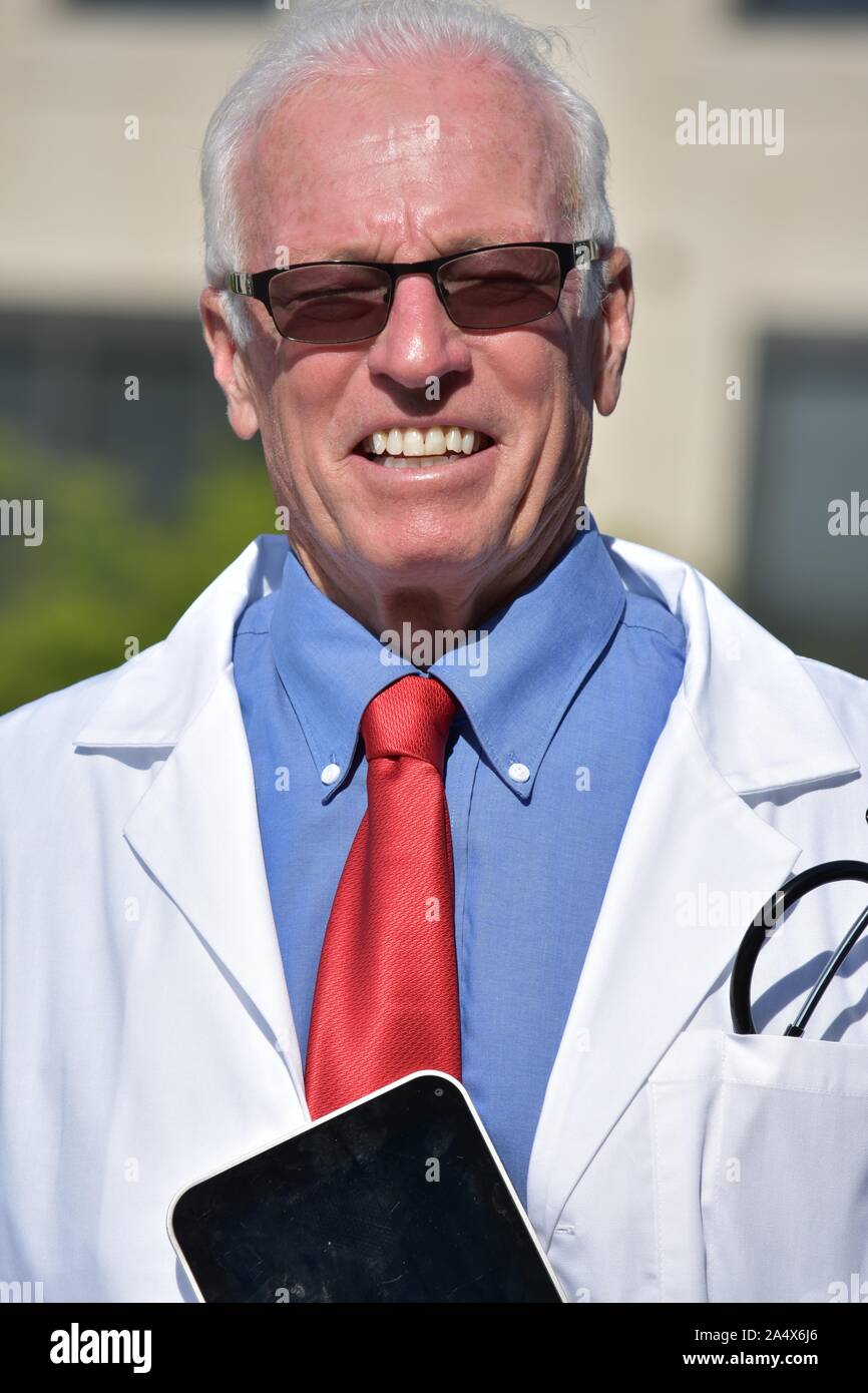 Smiling handsome male doctor hi-res stock photography and images - Alamy