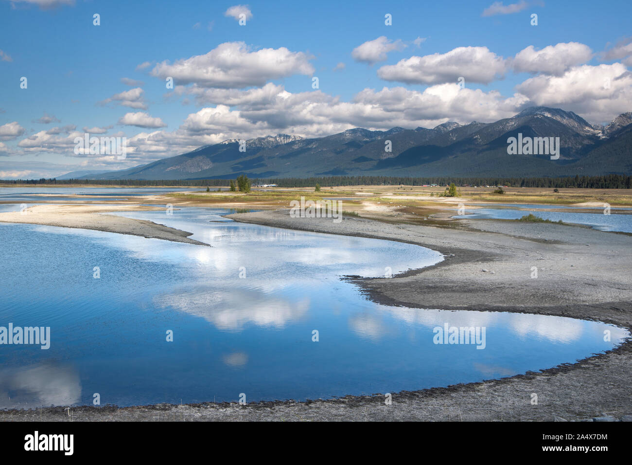 A panorama of Kicking Horse Reservoir and the Mission Mountains south