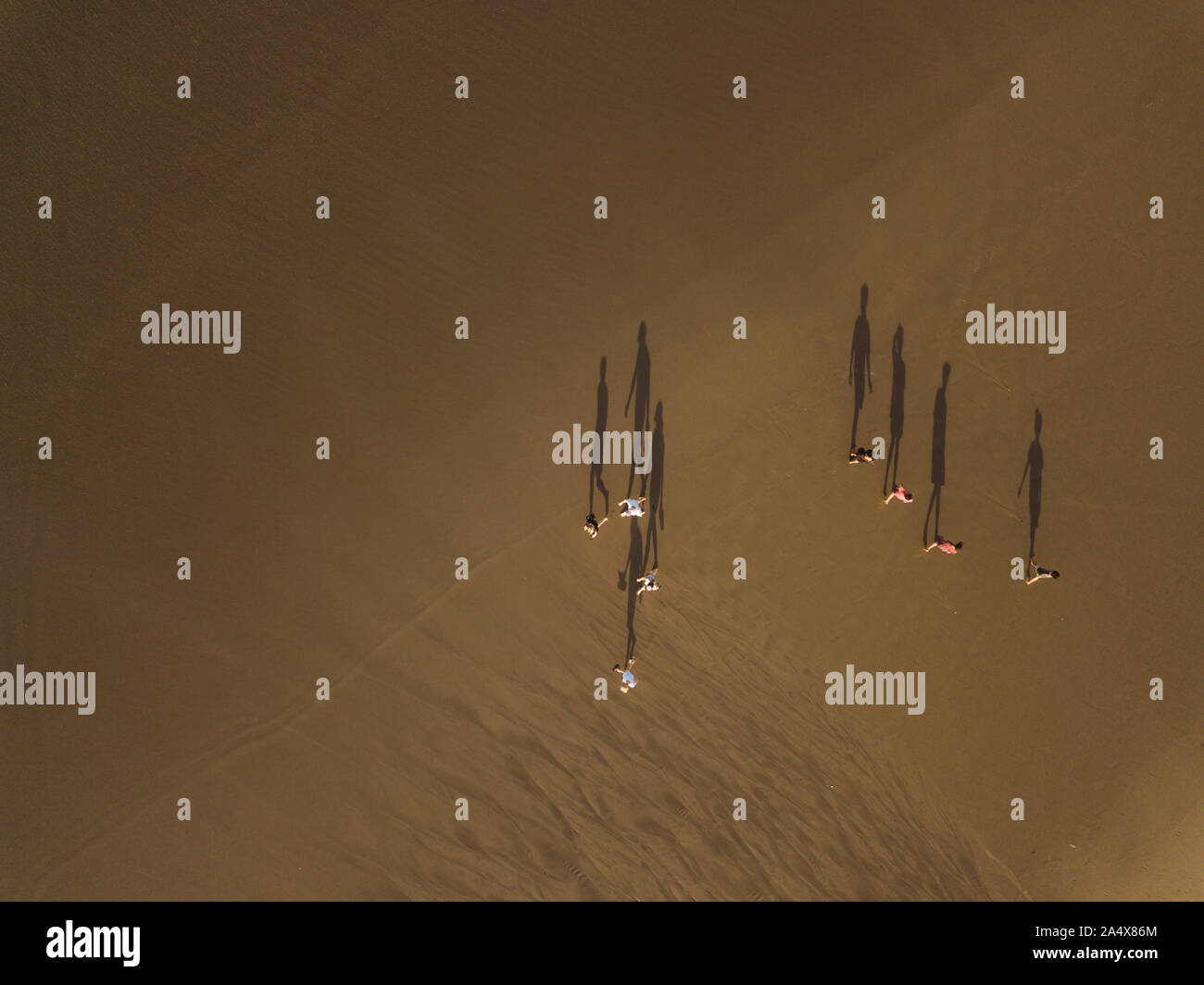 Aerial view of people walking at the beach Stock Photo - Alamy