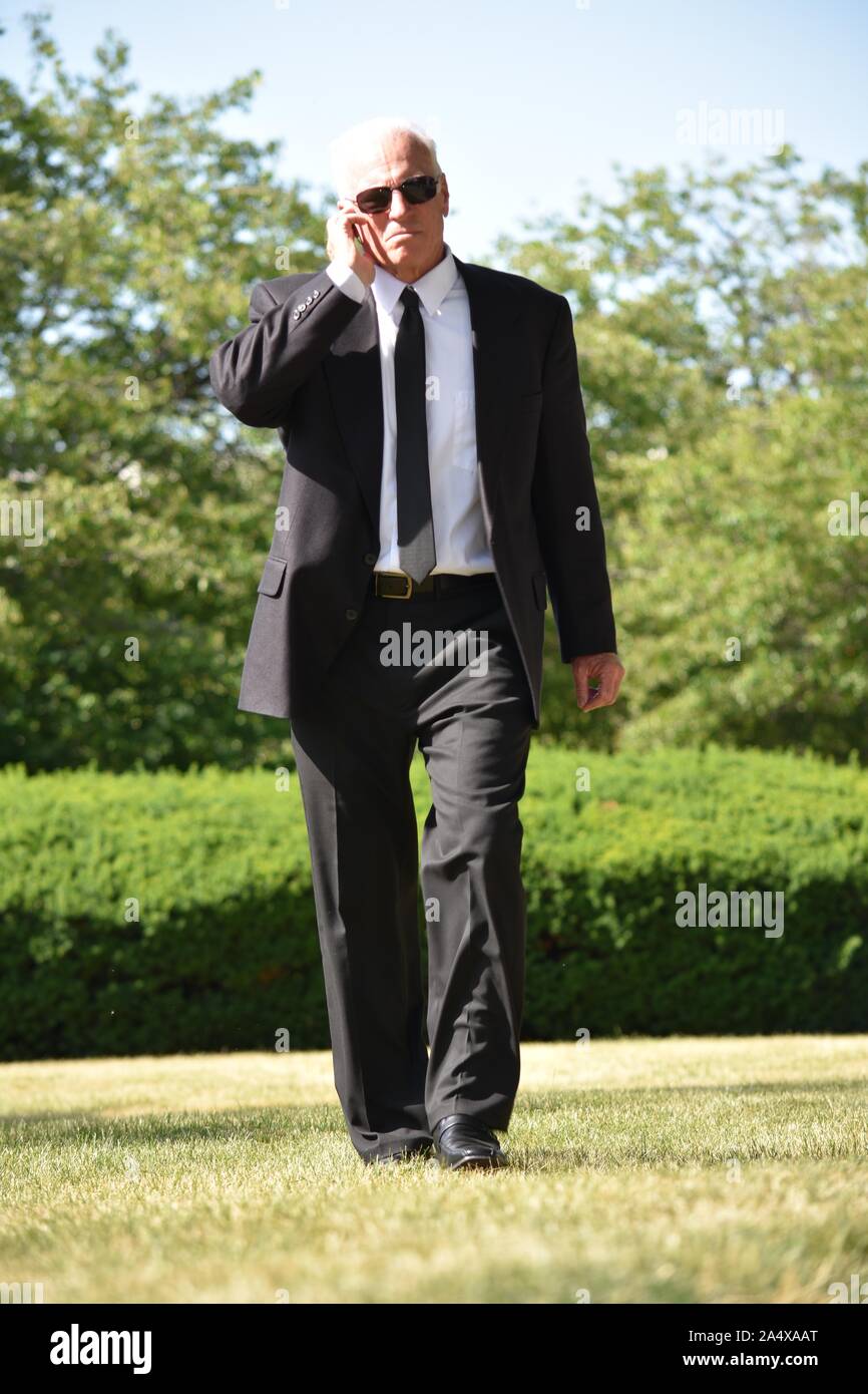 Security Guard Hearing Wearing Sunglasses Walking Stock Photo Alamy