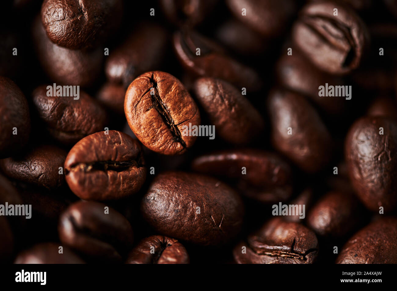 Close up of roasted coffee beans for background, texture and design. Selective focus. Stock Photo
