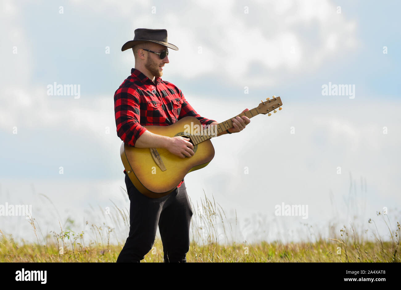 Inspired Country Musician Country Style Summer Vacation Country Music Concept Guitarist Country Singer Stand In Field Sky Background Hiking Song Play Beautiful Melody Handsome Man With Guitar Stock Photo Alamy
