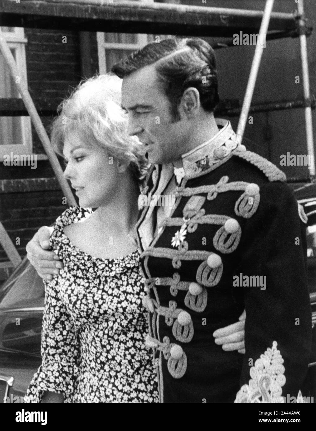 KIM NOVAK and RICHARD JOHNSON on set candid during filming at Pinewood Studios of KHARTOUM 1966 director Basil Dearden Julian Blaustein Productions Ltd / United Artists Stock Photo