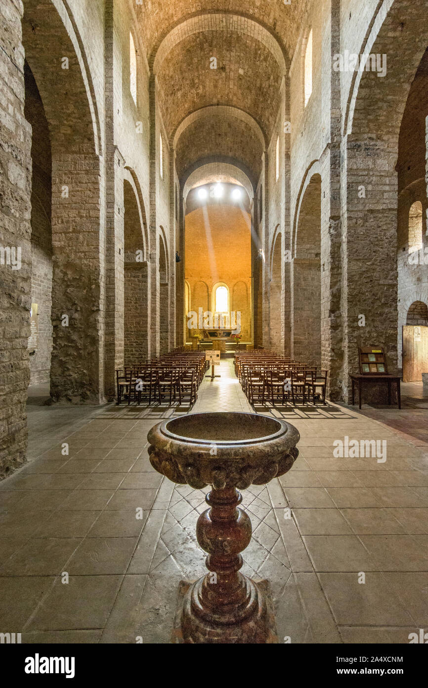 The font, the Romanesque nave and the choir of the abbey church of
