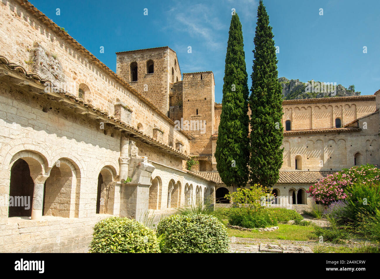 The cloister, its garden and the church of the abbey of Saint Guilhem