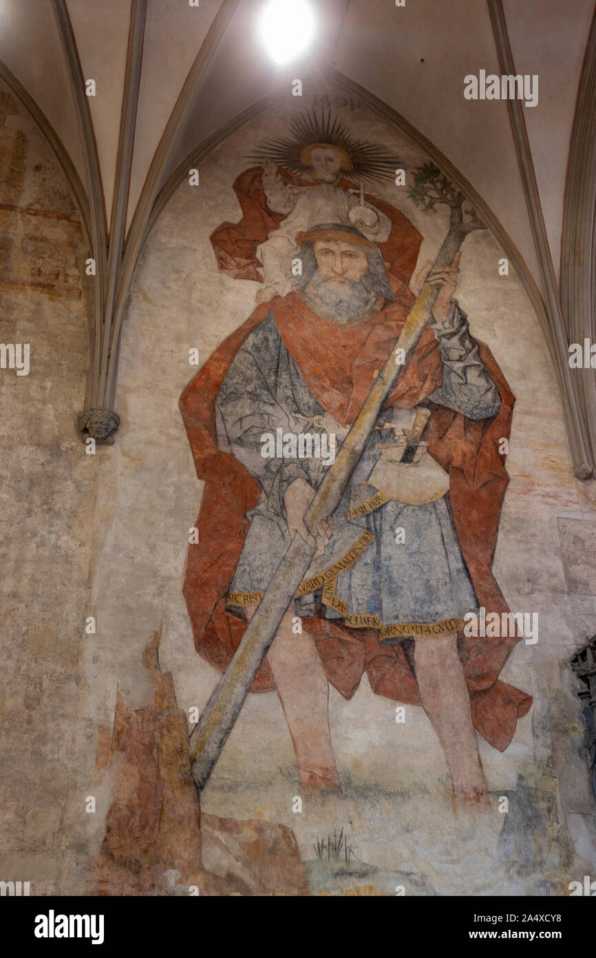 Large fresco of St Christopher in the southern transept of  Augsburger Dom (Cathedral of Augsburg), Augsburg, Bavaria, Germany. Stock Photo