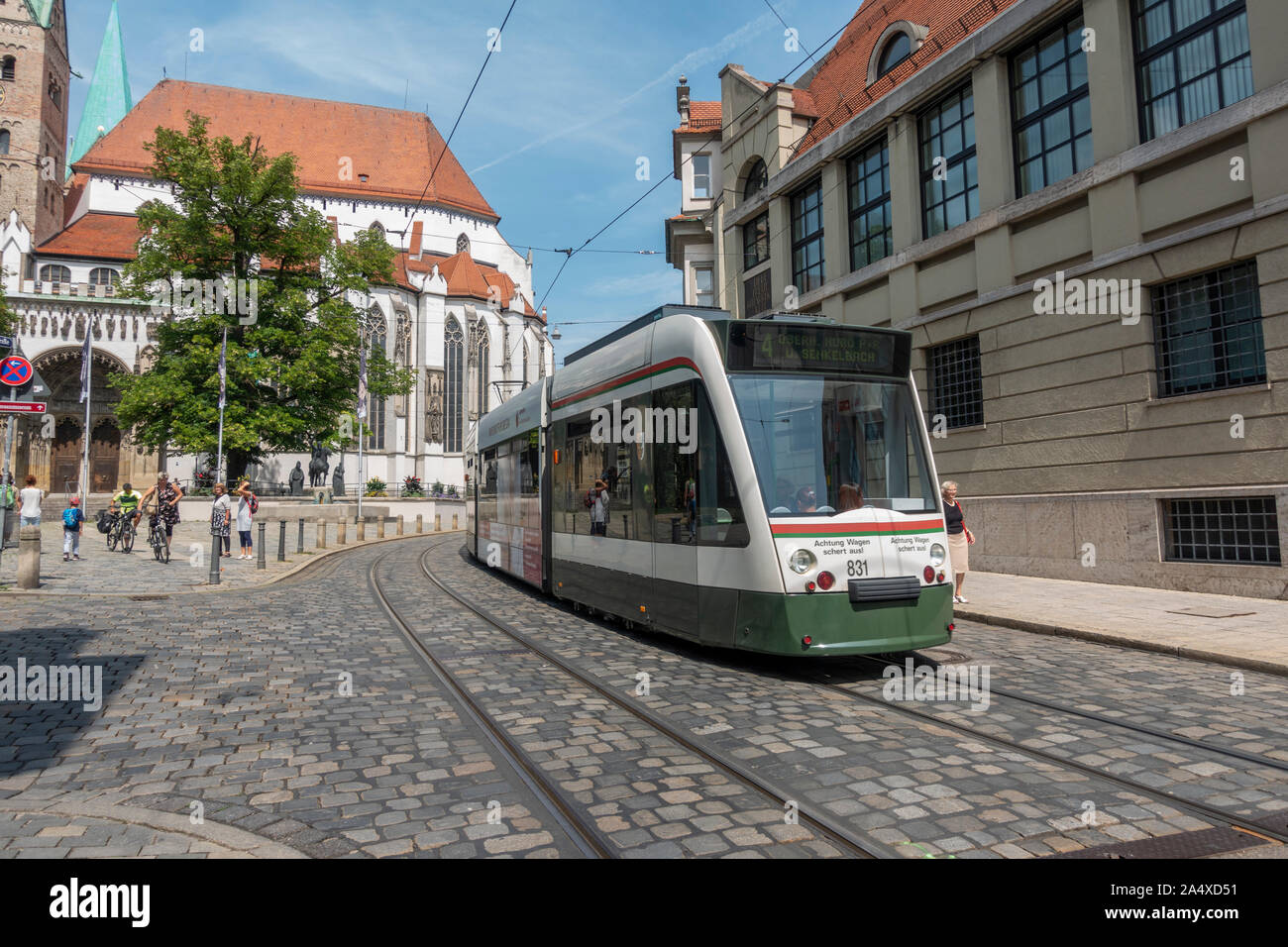 An electric tram passing through the centre of Augsburg, Bavaria, Germany. Stock Photo