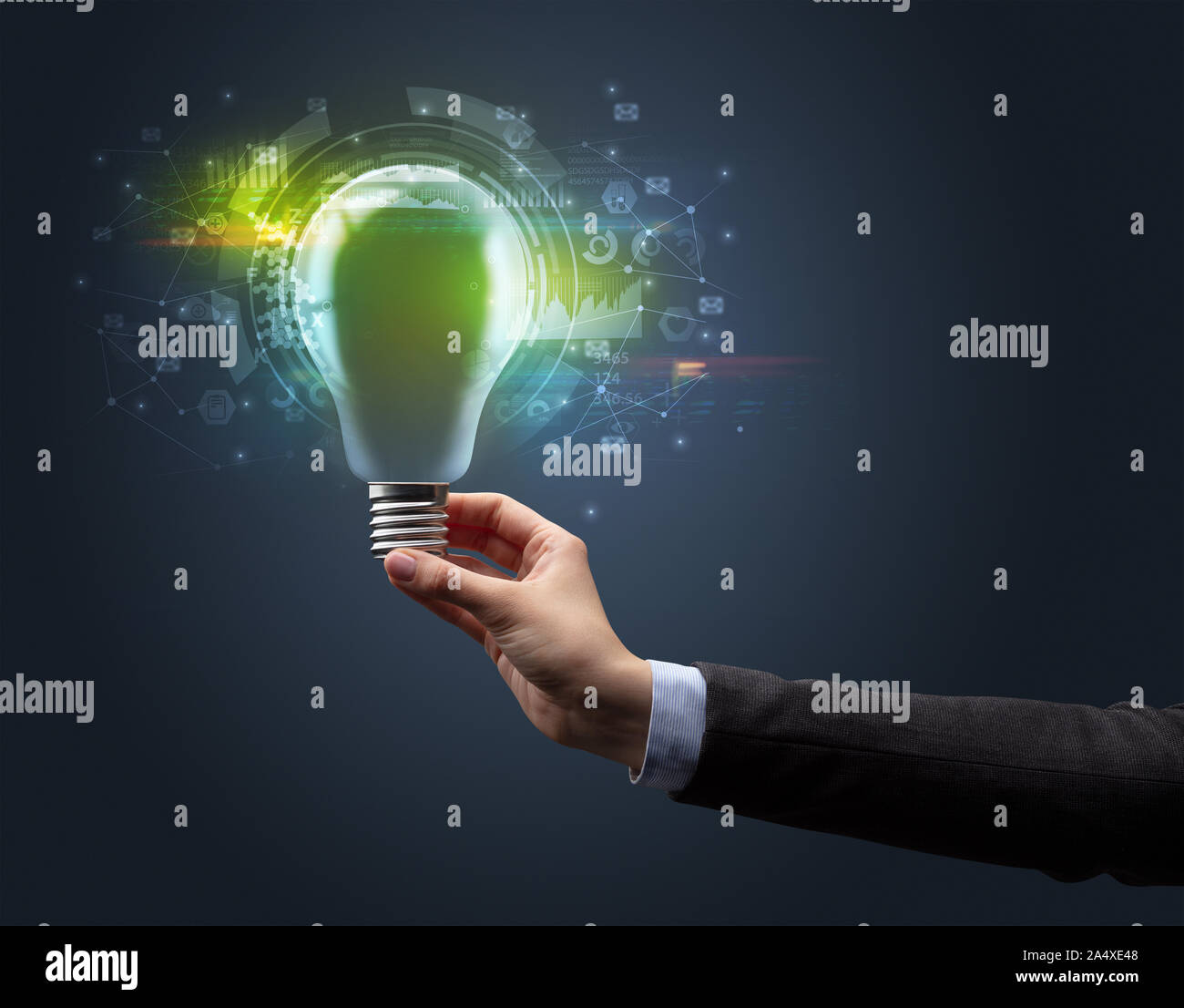 Hand holding light bulb on dark background. New business idea concept ...