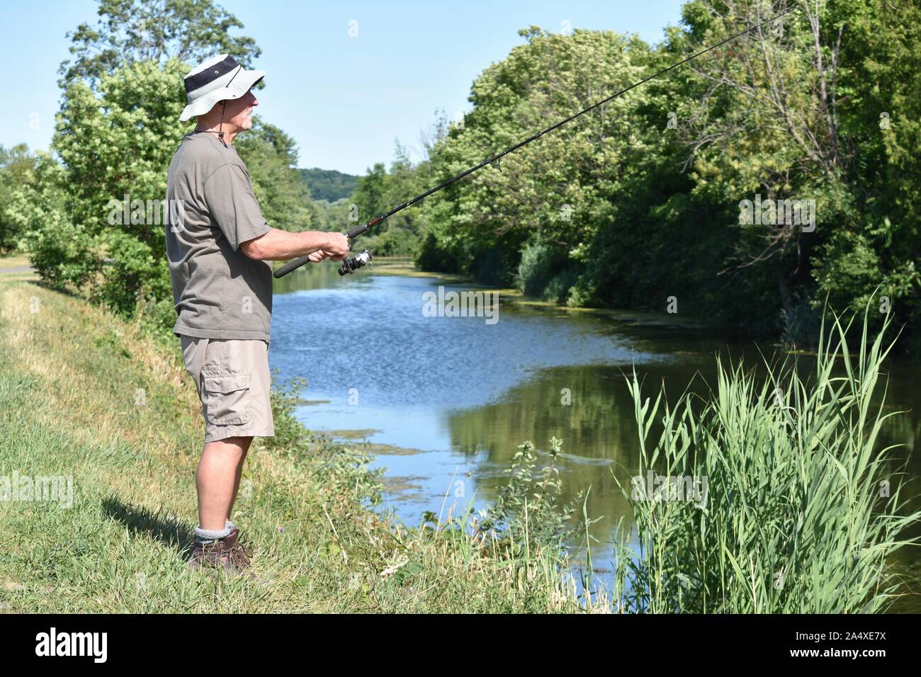 Old standing fisherman hi-res stock photography and images - Alamy