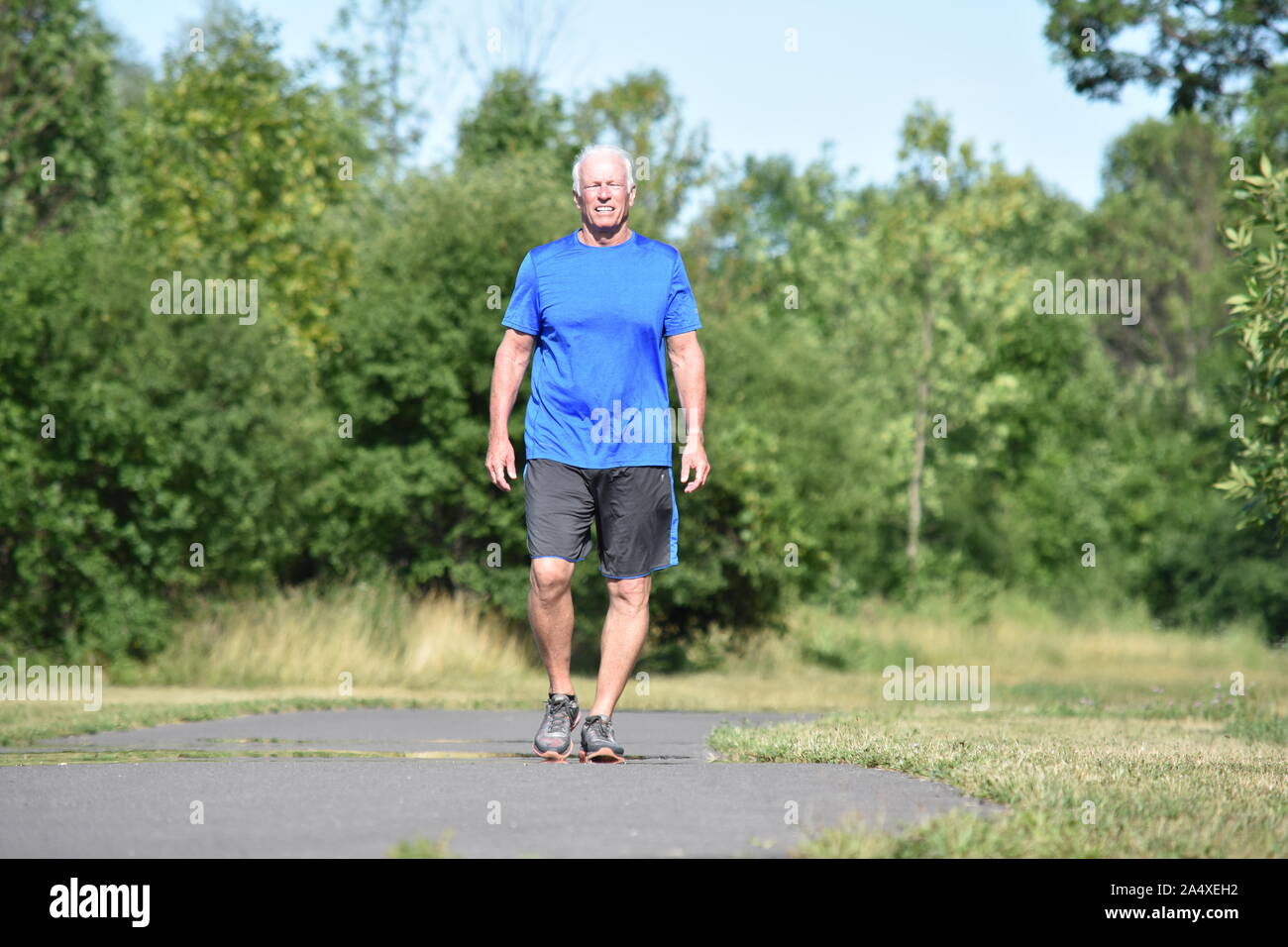 Older person walking smiling hi-res stock photography and images - Alamy
