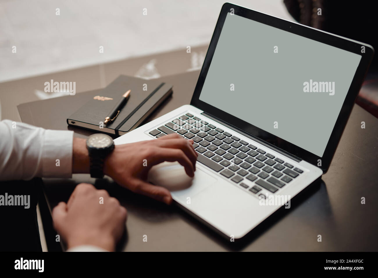 Man using, working on laptop with white screen. startup Stock Photo