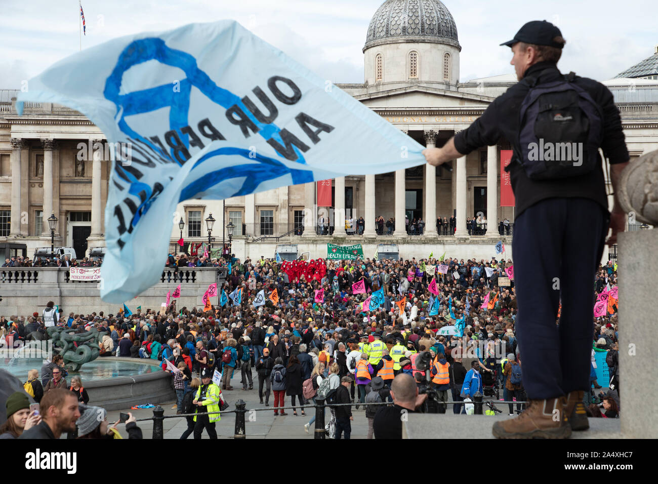 London, UK. 16th October 2019. General overview of Extinction Rebellion protesters seen on Trafalgar Square in defiance of the Section 14 of the Public Order Act 1986, issued by the police, to cease any protests within London by the climate action group. Credit: Joe Kuis / Alamy News Stock Photo