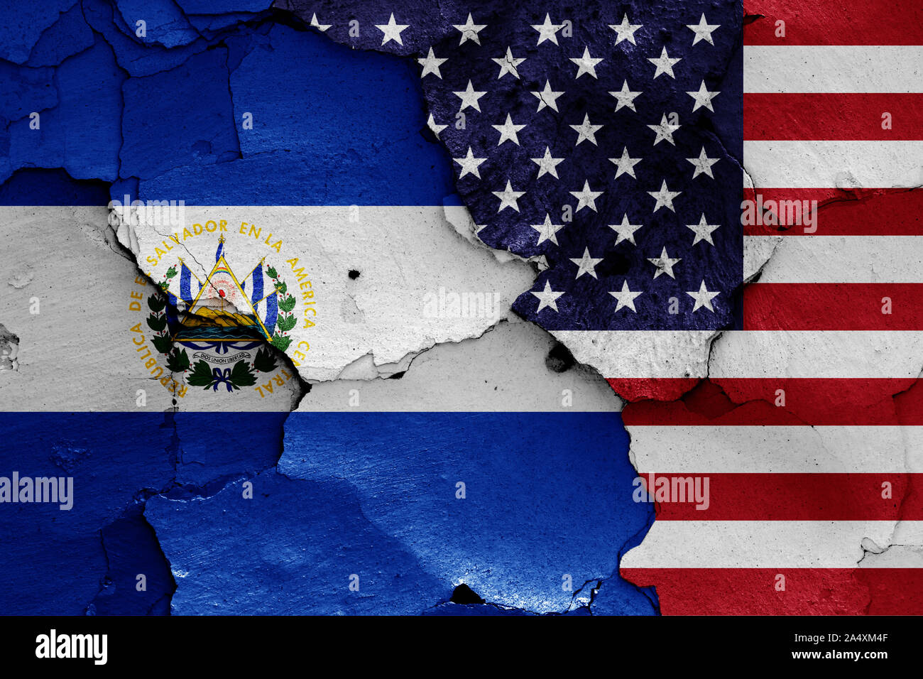 flags of El Salvador and USA painted on cracked wall Stock Photo