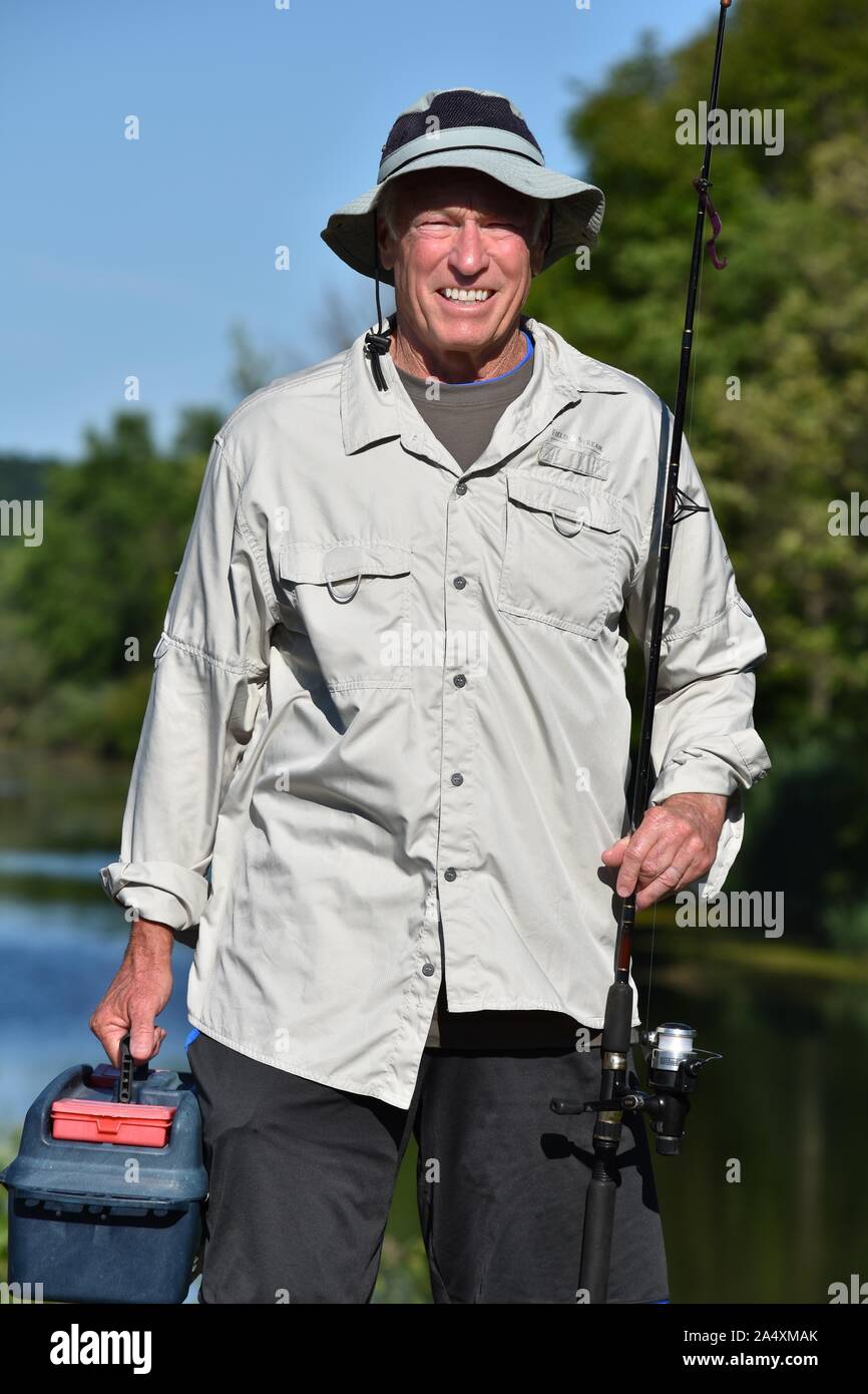 Old Senior Male Fisherman With Thumbs Up With Rod And Reel Fishing Stock  Photo
