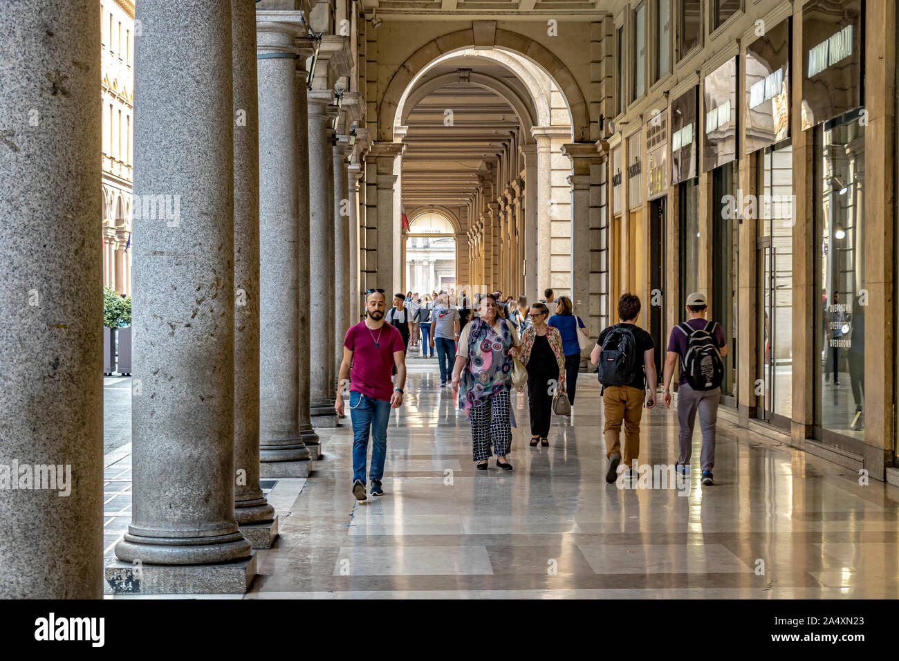 People strolling through the marble porticos of Via Roma , one of the main shopping area of Turin,Italy Stock Photo
