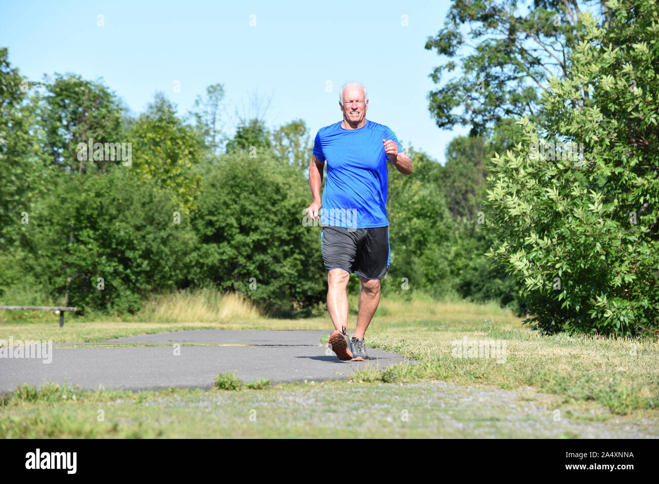 Happy Old Person Wearing Sneakers Exercising Stock Photo