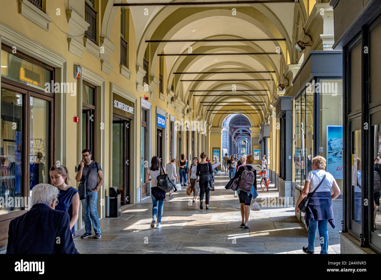 People walking through the elegant colonnaded arcades which run along Piazza Carlo Felice in Turin,Italy Stock Photo