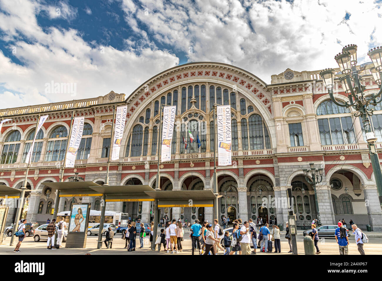 People waiting for buses in front of Torino Porta Nuova railway station ,Turin's main and busiest railway station ,Turin ,Italy Stock Photo