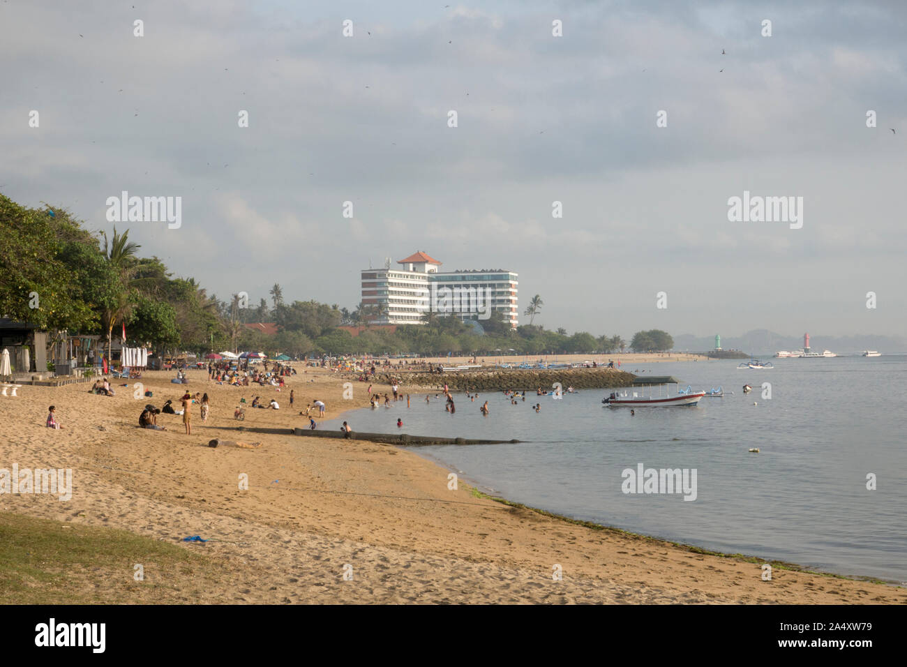 Tourists relaxing on beach in Sanur, Bali Stock Photo
