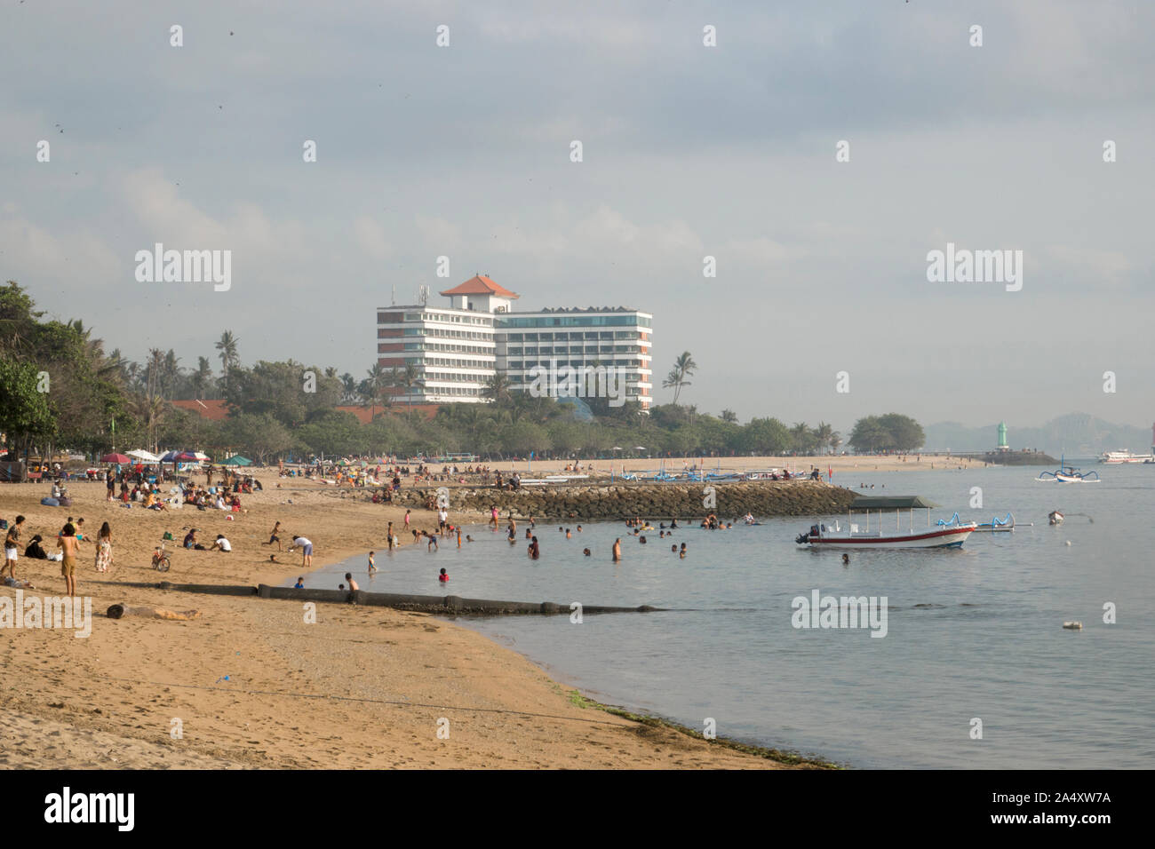 Tourists relaxing on beach in Sanur, Bali Stock Photo