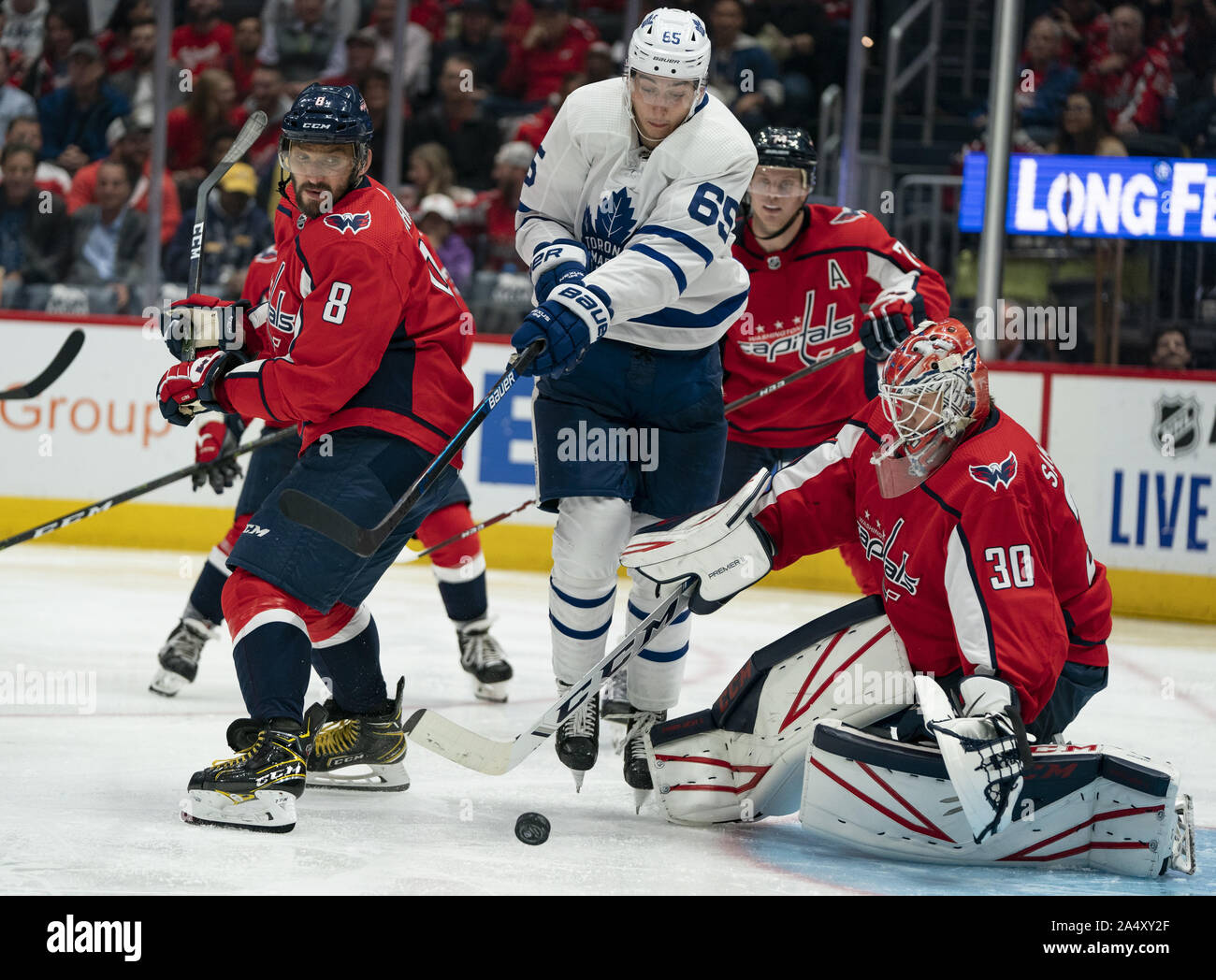 Washington, United States. 16th Oct, 2019. Washington Capitals goaltender Ilya Samsonov (30) attempts a save as Toronto Maple Leafs right wing Ilya Mikheyev (65) deflects a shot while defended by Capitals left wing Alex Ovechkin (8) during the third period at Capital One Arena in Washington, DC on Wednesday, October 16, 2019. The Capitals host the Toronto Maple Leafs to start a 3 game home stand tonight. Photo by Alex Edelman/UPI Credit: UPI/Alamy Live News Stock Photo